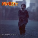 puckett - burned like wood CD 10 tracks used mint