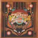 zutons - tired of hanging around CD 2006 columbia red ink 11 tracks used like new 82876822722