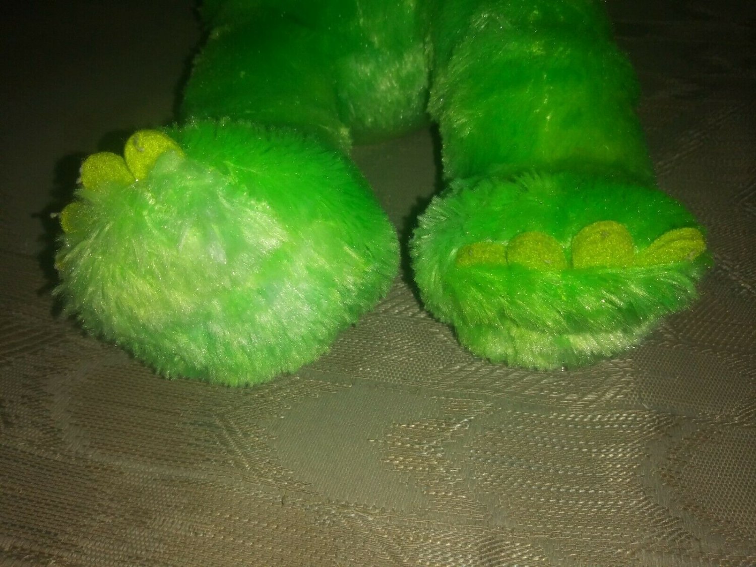 green stuffed triceratops