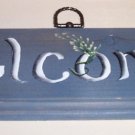 Welcome sign with blue gray background
