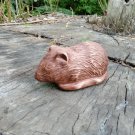 Figurine of a rat made of wood. Rat figurine. Sculpture of a rat.