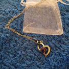 Silver tone heart shaped pendent necklace with purple simulated stone