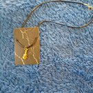 Guitar necklace pendent on corded necklace