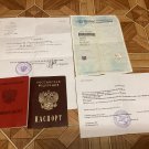 A trophy set of documents, a passport, and a military ID from the Russian occupier. War in Ukraine. A trophy set of documents, a passport, and a military ID from the Russian occupier. War in Ukraine.