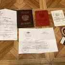 A trophy set of documents, a passport, and a military ID from the Russian occupier. War in Ukraine. A trophy set of documents, a passport, and a military ID from the Russian occupier. War in Ukraine.