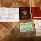 A trophy set of documents, a passport, and a military ID from the Russian occupier. War in Ukraine. A trophy set of documents, a passport, and a military ID from the Russian occupier. War in Ukraine.