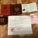 A trophy set of documents, a passport, and a military ID from the Russian occupier. War in Ukraine. A trophy set of documents, a passport, and a military ID from the Russian occupier. War in Ukraine.