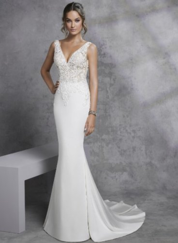 A classic fit and flare wedding dress with a striking lace applique