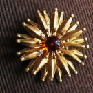 ball tipped spiny starburst brooch with amber glass center - vintage jewelry
