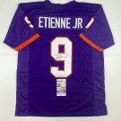 Autographed/Signed Travis Etienne Jr. Clemson Purple College Football Jersey JSA
