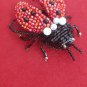 Handmade beaded brooch "Ladybug"