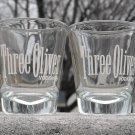 Set of 4 Three Olives Vodka shot glasses 1 oz white logo