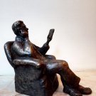 Bronze Statue of a man reading a book