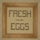 Framed stitched piece in barnboard frame