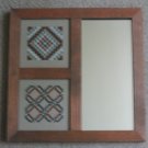 Stitched pieces in 3 section mirror frame