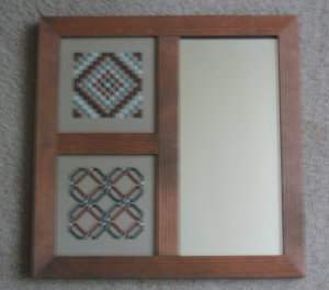 Stitched pieces in 3 section mirror frame