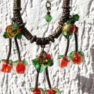 Necklace with berries in pearls and Murano style glass leaves on rubber cord: "La ceriseraie"