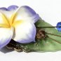 Bronze brooch including a large flower on a lucite leaf all adorned with four glass beads: "Exotic"