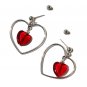 Silvered heart-shaped earrings with a small red glass heart in the center: "Tender Lover"