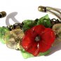 Bronze bracelet with three flowers and leaves in lucite: "Flora"