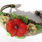 Bronze bracelet with three flowers and leaves in lucite: "Flora"