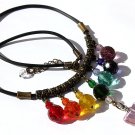 Necklace in faceted glass beads in the colors of the chakras adorned with a pink heart:"The chakras"