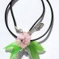 Pendant necklace with a large crystal drop adorned with a flower and lucite leaves: "Drop of light"
