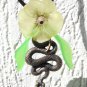 Pendant necklace with a snake adorned with a flower and leaves on a rubber cord:"Temptation"