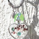 Pendant with a large glass heart inlaid with blue and pink small flowers:"Love is the key"