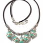 Necklace with five green gold and silver glass beads mounted on a rubber cord: "Malaga"