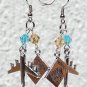Silvered earrings with a plane and a passport adorned with a yellow and blue pearl: "Airlines"