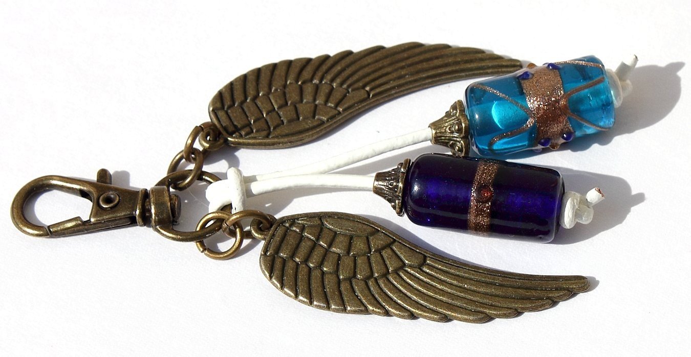 Bronze bag charm with wings and blue glass lampwork - "Spirit"