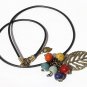 Necklace with a bronze leaf adorned with six colored ceramic beads: "Effeuillade"