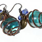 Earrings with blue glass beads wrapped in copper wire and small bronze leaves:"Zébulonia"