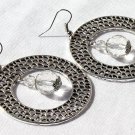 Large silver hoop earrings with a transparent faceted glass bead in the center: "Lacelia"