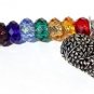Silvered bag charm with faceted glass beads in the colors of the seven chakras:"Route du coeur"