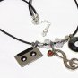 Necklace with silvered charms relating to the music of the 60s and 70s: "Oldies"