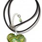 Pendant with a heart in greent and yellow stripes on leather cord:"ZÃ©brina"