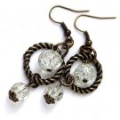 Bronze earrings with a twisted ring and two transparent "cracked" pearls: "You make me crack"