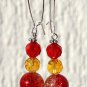 Silvered earrings with two-tone cracked red and yellow faceted pearls: "Cherry peach duo"