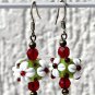 Bronze set with necklace and matching green lampwork earrings with white flowers:"Pomme Cerise"