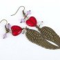Bronze earrings with large angel wings, purple crystal beads and a red glass heart