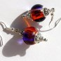 Silvered earrings with purple and copper two-tone glass beads: "Aube"