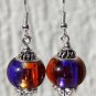 Silvered earrings with purple and copper two-tone glass beads: "Aube"