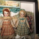 Two tiny 3" All Bisque German Miniature Dollhouse dolls in Box of Cacao and Tea set