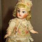 Sweet  31/2" Bisque head ( Glass eyes, swivel head) Mignonette doll w/box of mini accessories