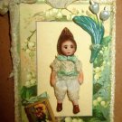 Littlest 1 3/4" OOAK (artist) Baby Bunny doll on Lily of the Valley Card