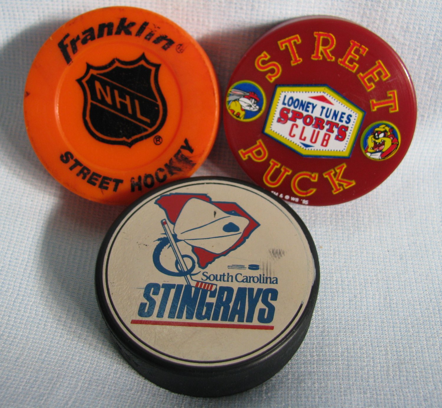 Hockey Pucks Franklin STREET ROLLER Orange + Stingrays + Looney Tunes