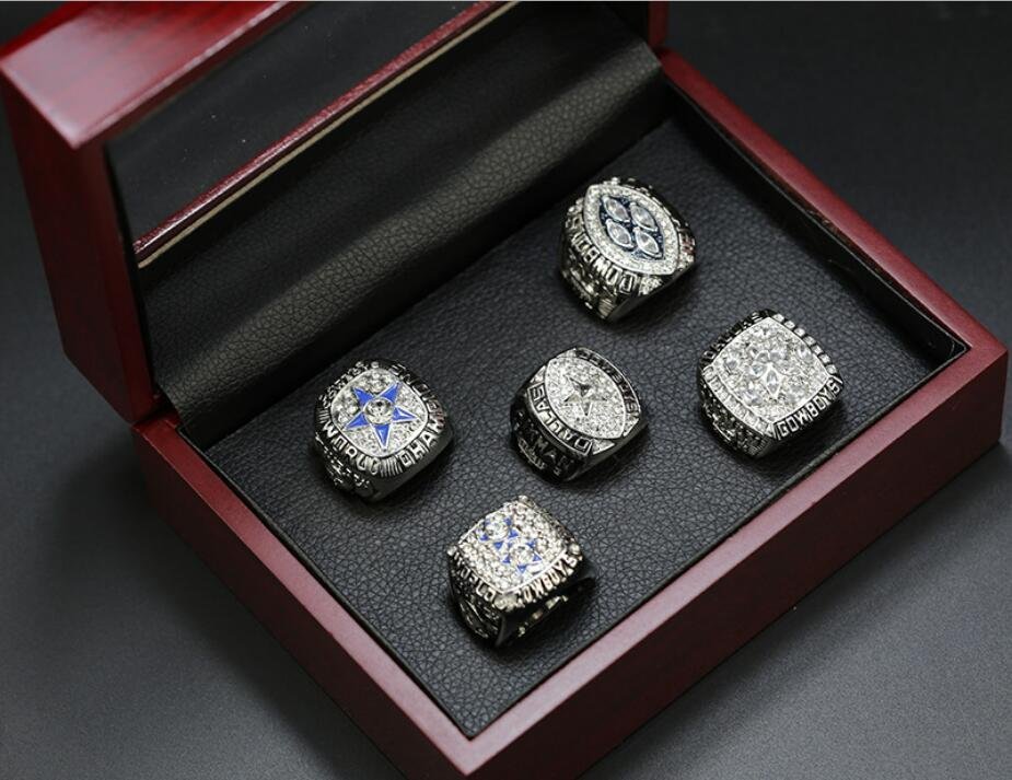 A Set Dallas Cowboys Super Bowl Championship Silver Rings With Wooden