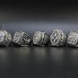 A Set Dallas Cowboys Super Bowl Championship Silver Rings With Wooden